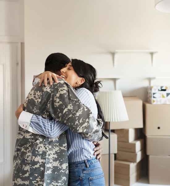 Soldier and woman embracing